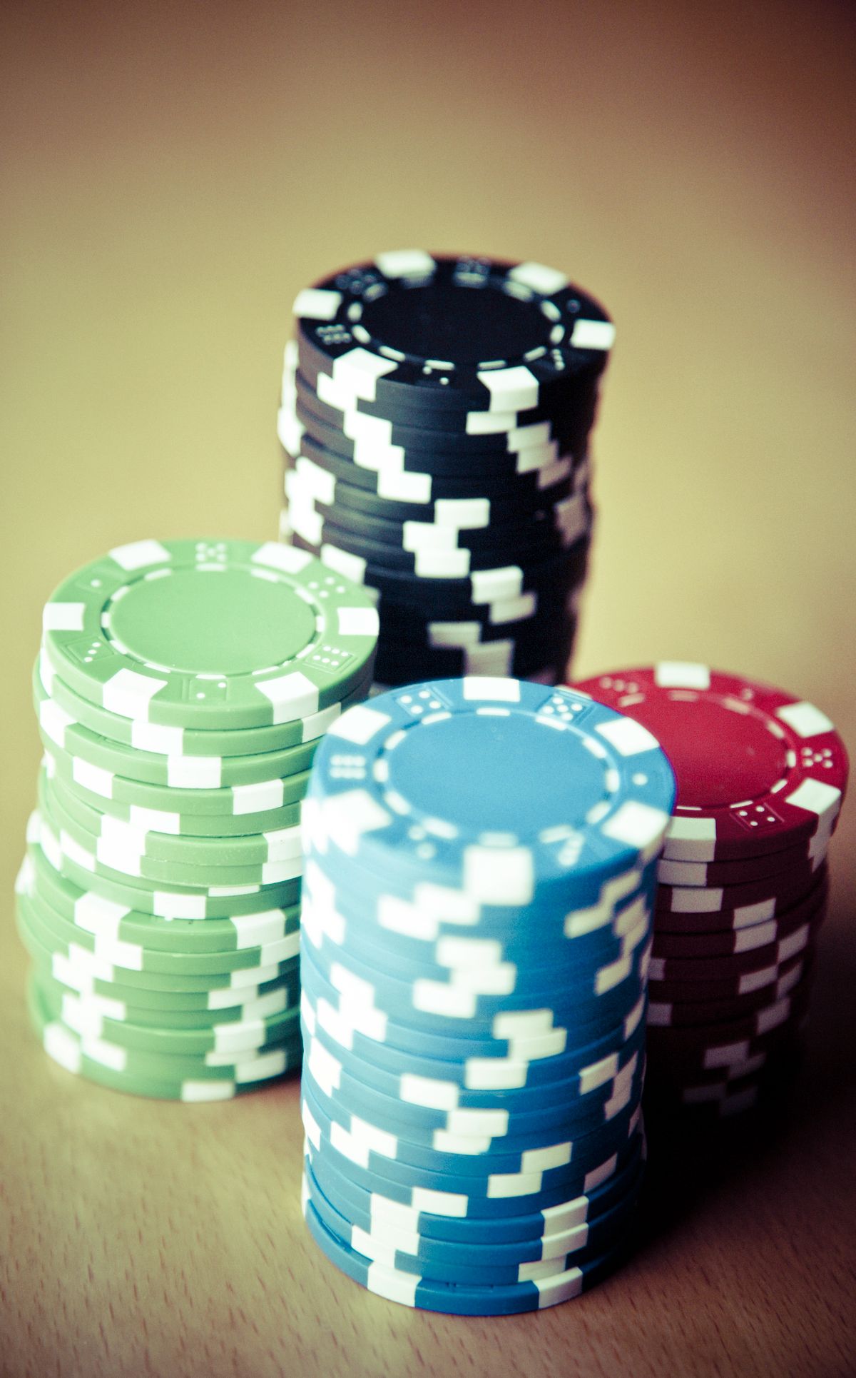 Stacks of colourful casino chips, evoking Sunbet's Sun International casino heritage